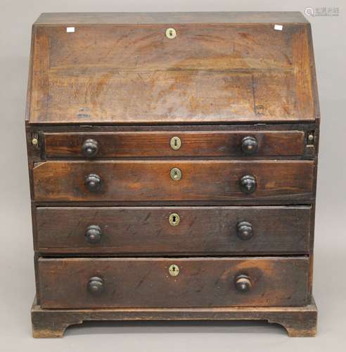 A Georgian oak bureau. 88.5 cm wide.