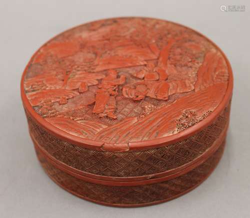 A 19th century Chinese carved cinnabar lacquer circular box....