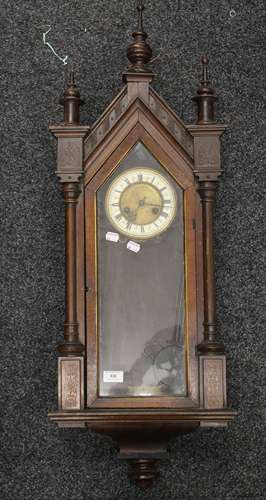 A 19th century walnut cased Vienna wall clock. 99 cm high.