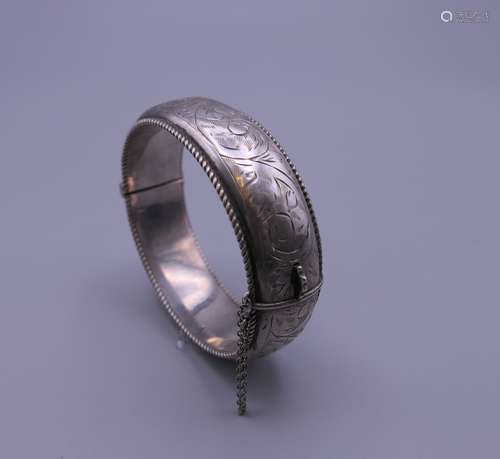 A silver bangle. 6 cm internal diameter. 29.7 grammes.