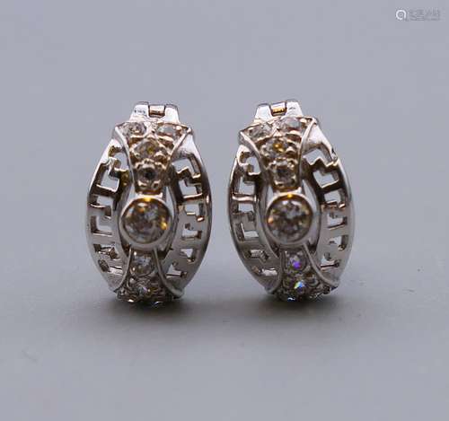 A pair of 9 ct white gold stone set earrings. 1.2 cm high. 2...