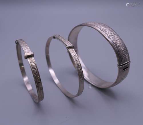 Three silver Christening bangles. The largest 6.5 cm diamete...