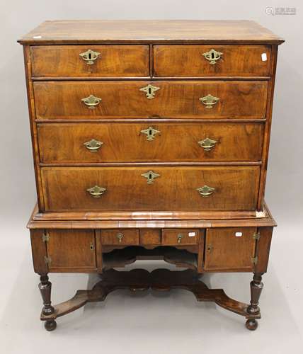 An 18th century walnut chest on stand. 101 cm wide x 129.5 c...