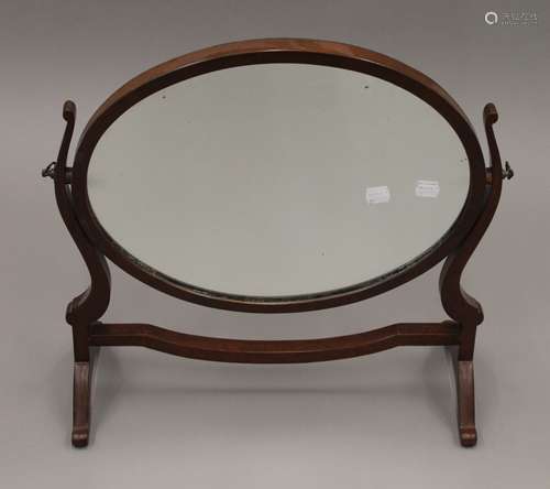 A Victorian mahogany toilet mirror. 51 cm wide.