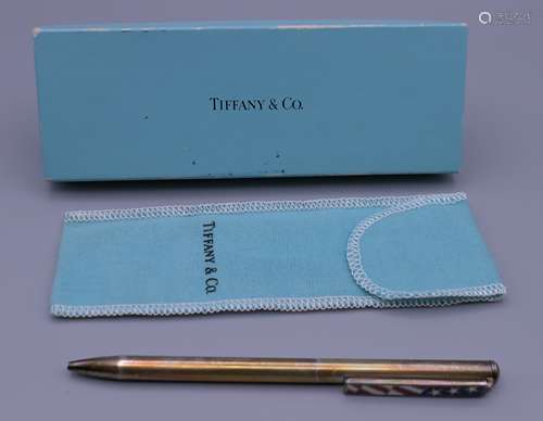 A Tiffany silver pen with American Flag clip. 13.25 cm long.