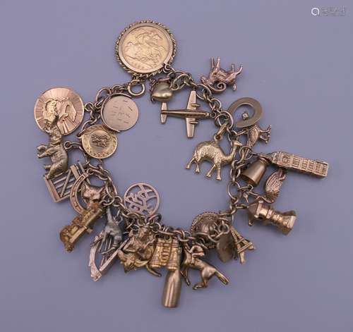 A 9 ct gold charm bracelet. 20 cm long. 52.5 grammes total w...