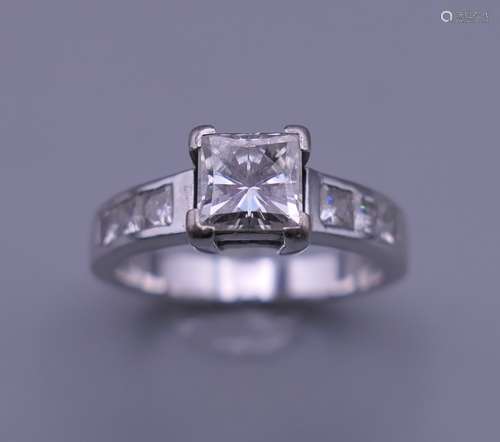 An 18 ct gold princess cut diamond solitaire ring. Diamond 0...