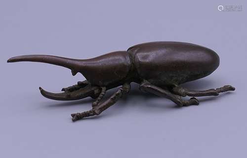 A bronze model of a beetle. 8 cm long.