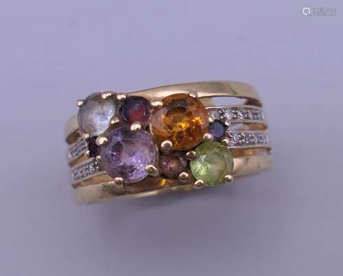 A 9 ct gold multi-stone and diamond ring. Ring size N/O.