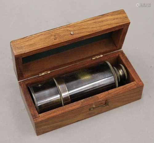 A modern boxed telescope. The box 18 cm wide.