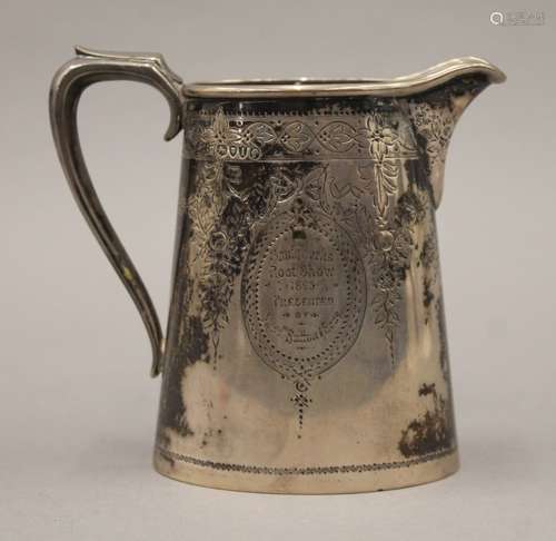 A Victorian silver presentation jug. 11.5 cm high. 218.9 gra...