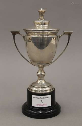 A small silver lidded trophy cup. 18.5 cm high overall. 202....