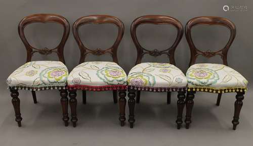 A set of four Victorian balloon back dining chairs.