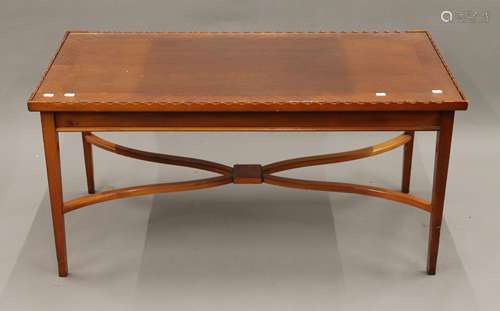 A modern coffee table. 113 cm long.