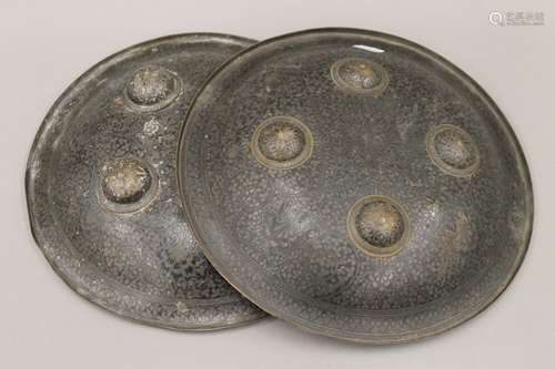 A pair of 19th century Indian dhal shields. Each 28.5 cm dia...