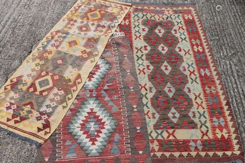 Three small Kilim rugs. The largest 100 x 201 cm.