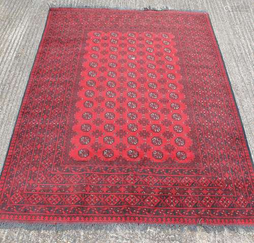 A red ground Balouch rug. 288 x 195 cm.