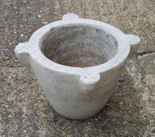 A large marble mortar. 22 cm high, 28 cm diameter.