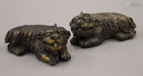 A pair of Chinese gilt bronze recumbent temple lions. 13 cm ...