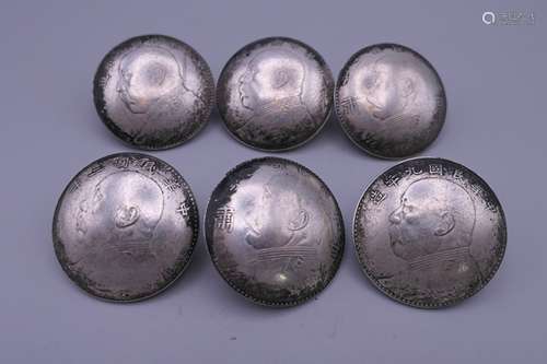 A set of six Chinese silver buttons. 3.5 cm diameter.