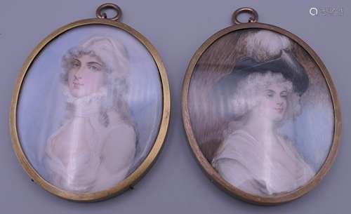 A pair of brass oval framed miniatures. Each 8 x 6.5 cm excl...