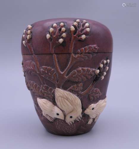 A Japanese bone and wood box decorated with chickens and fol...