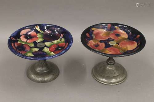 A Moorcroft tazza with beaten pewter base, together with ano...