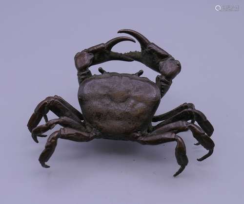 A large bronze model of a crab.