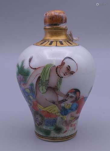 A snuff bottle decorated with an erotic scene. 8.5 cm high.