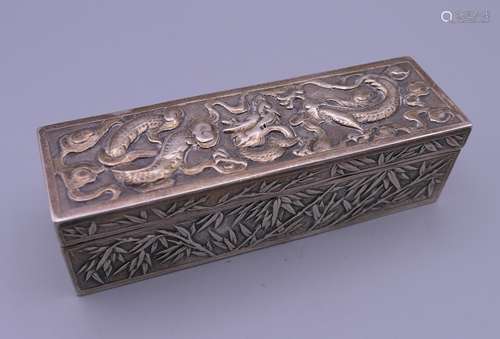 A Chinese silver box. 13 cm wide x 3.75 cm high x 4 cm deep....