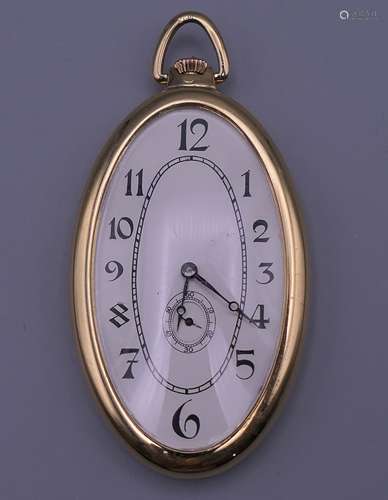 An 18 ct gold oval half hunter watch. 5.75 cm high excluding...