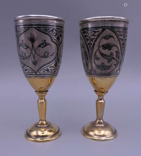 A pair of Russian silver and niello goblets. 11.3 cm high. 4...