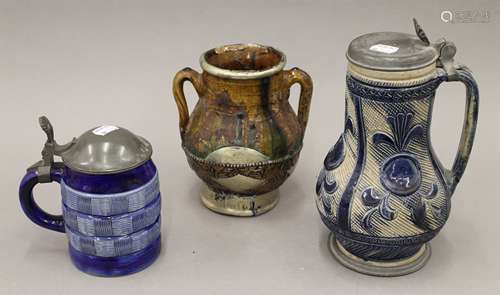 Two 19th century German steins and a jug. The largest 24 cm ...