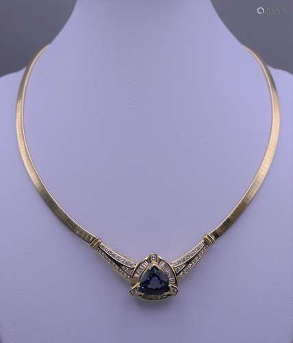 A 14ct gold tanzanite and diamond necklace. Approximately 46...