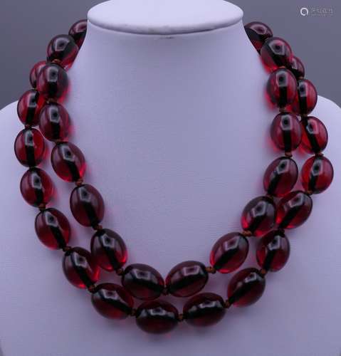 A bead necklace. Approximately 84 cm long.