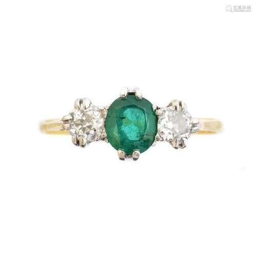 An 18ct gold emerald and diamond three stone ring,