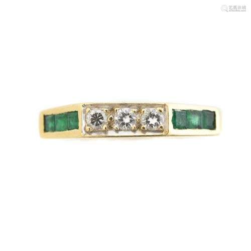 An emerald and diamond band ring,