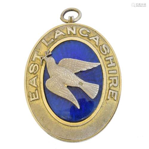 A silver gilt and enamel masonic locket,