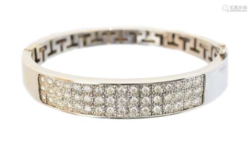 An 18ct gold diamond hinged bangle,