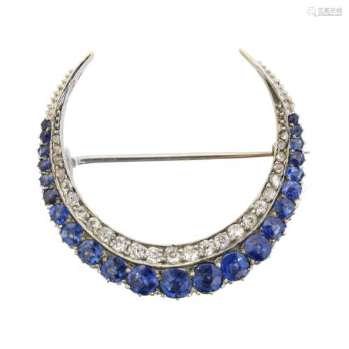 A sapphire and diamond crescent brooch,