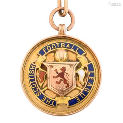 An early 20th century 9ct gold enamel football medallion,