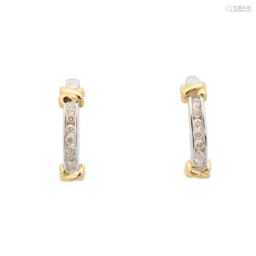 A pair of diamond hoop earrings,