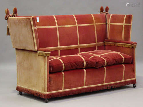 An early 20th century Knole settee, upholstered in pink velo...