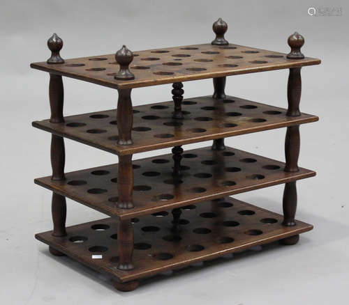 A late Victorian mahogany four-tier egg rack, pierced to hol...