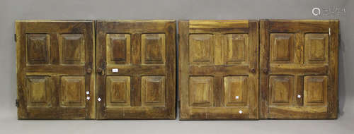 A set of four 19th century walnut cupboard doors, height 74c...