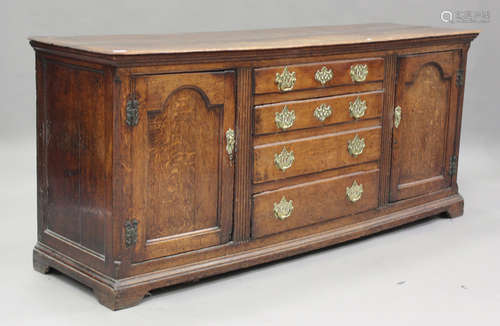 A George III oak dresser base, fitted with four drawers, fla...