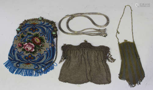 A late 19th century beadwork purse with gilt metal stone set...