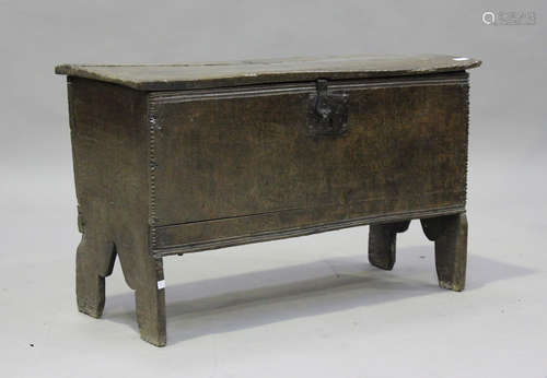 A 17th century oak six-plank coffer, the hinged lid revealin...