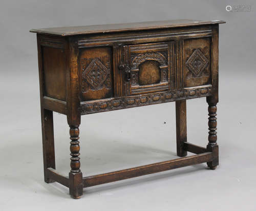 A 20th century Carolean Revival oak side cupboard, fitted wi...