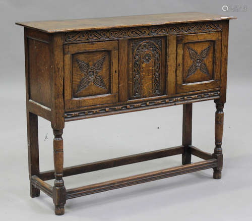 A 20th century Carolean Revival oak side cupboard, fitted wi...